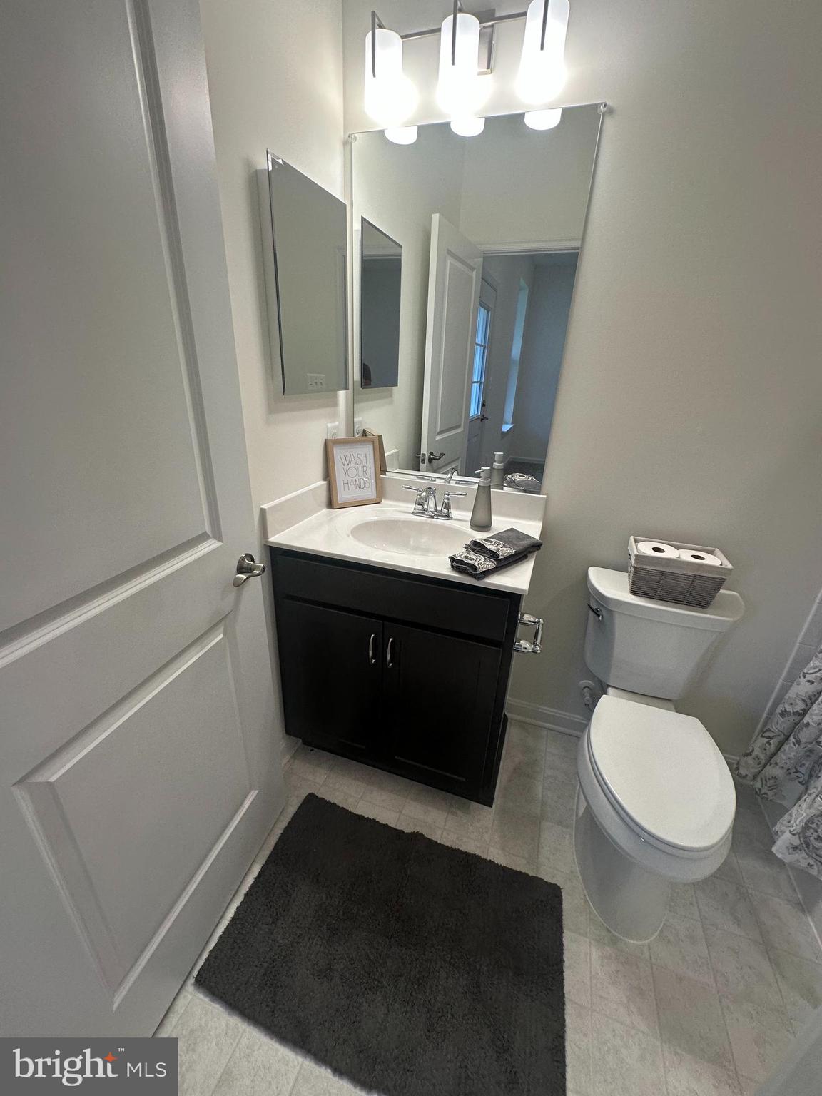 365 Purple Place Edgewood, MD 21040 - Photo 6 of 64 a bathroom with a toilet sink and mirror