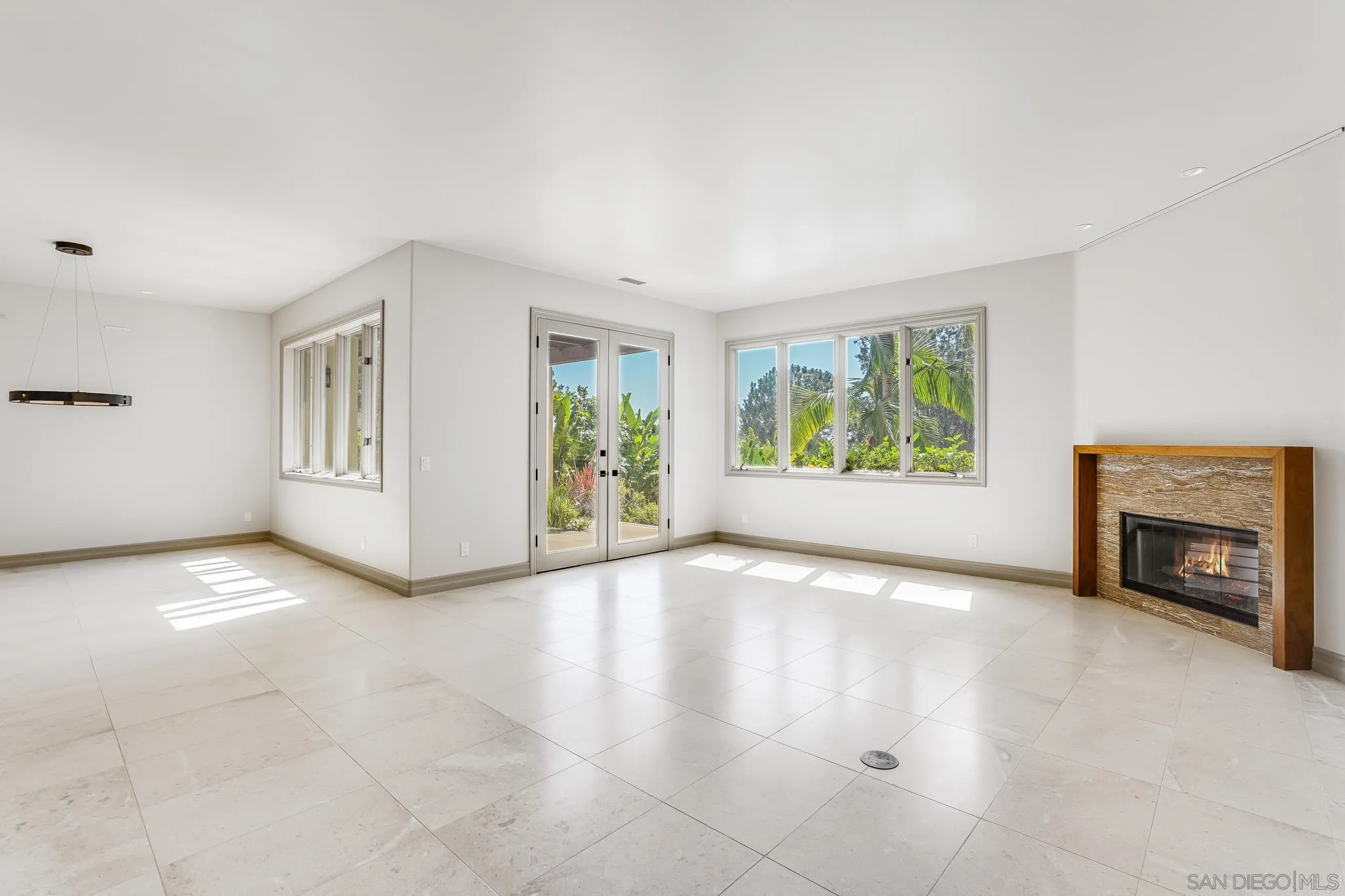 1346 Crest Road Del Mar, CA 92014 - Photo 20 of 64 an empty room with windows and fireplace