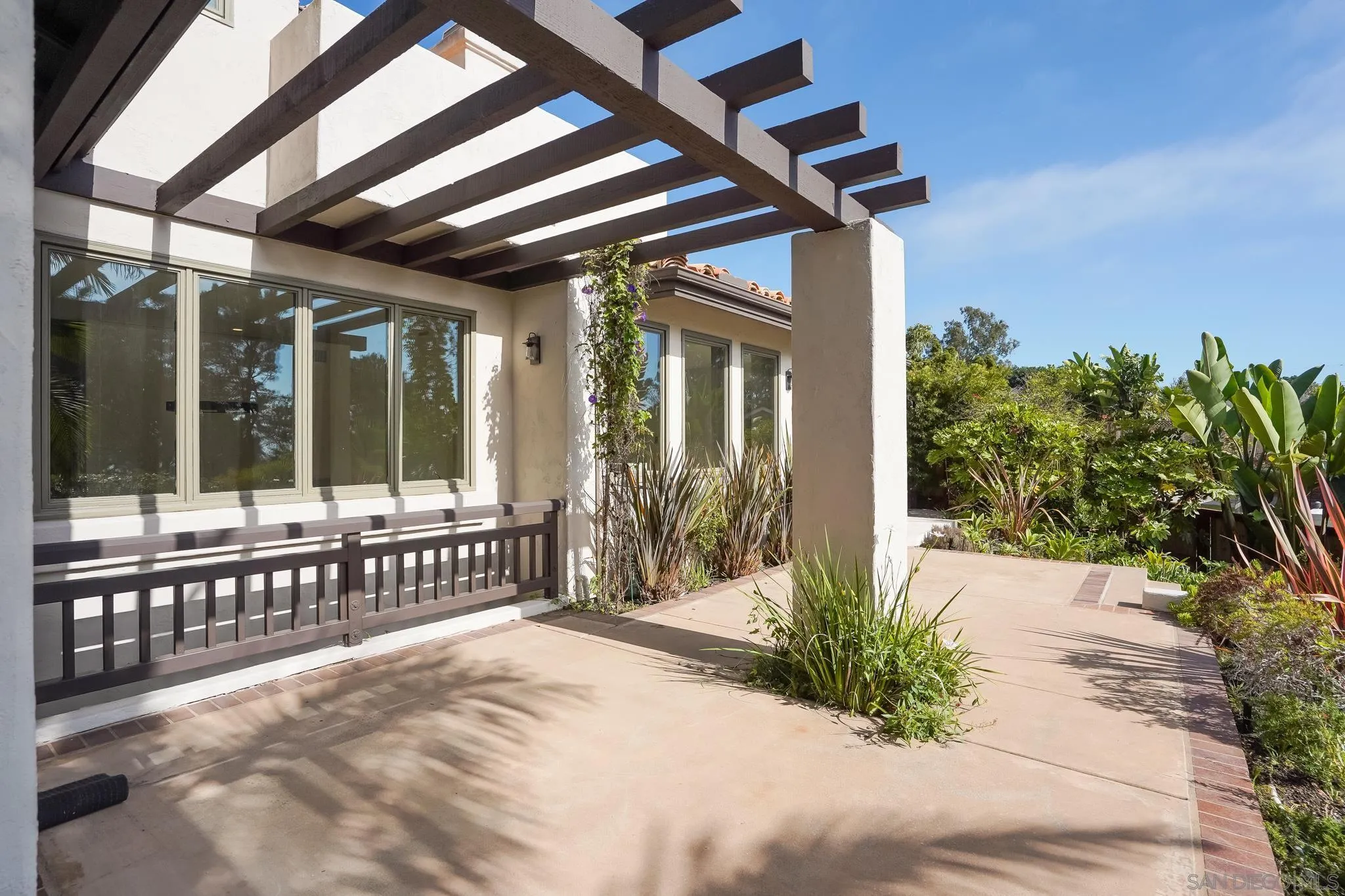 1346 Crest Road Del Mar, CA 92014 - Photo 28 of 64 a view of a house with a small yard and plants