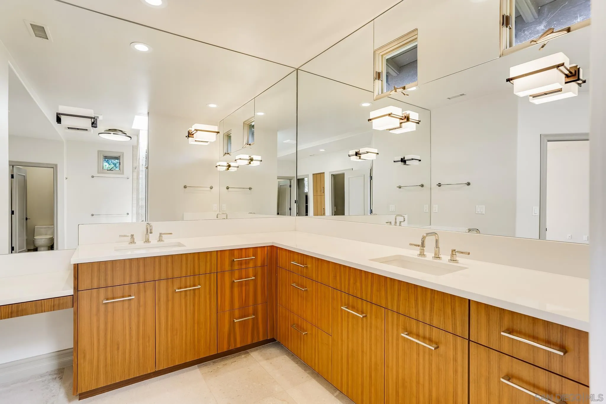 1346 Crest Road Del Mar, CA 92014 - Photo 40 of 64 a bathroom with a sink vanity granite tub and a mirror
