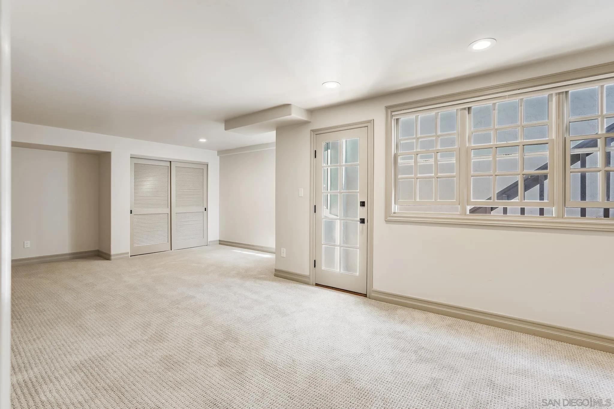 1346 Crest Road Del Mar, CA 92014 - Photo 56 of 64 an empty room with a cabinet and mirrors