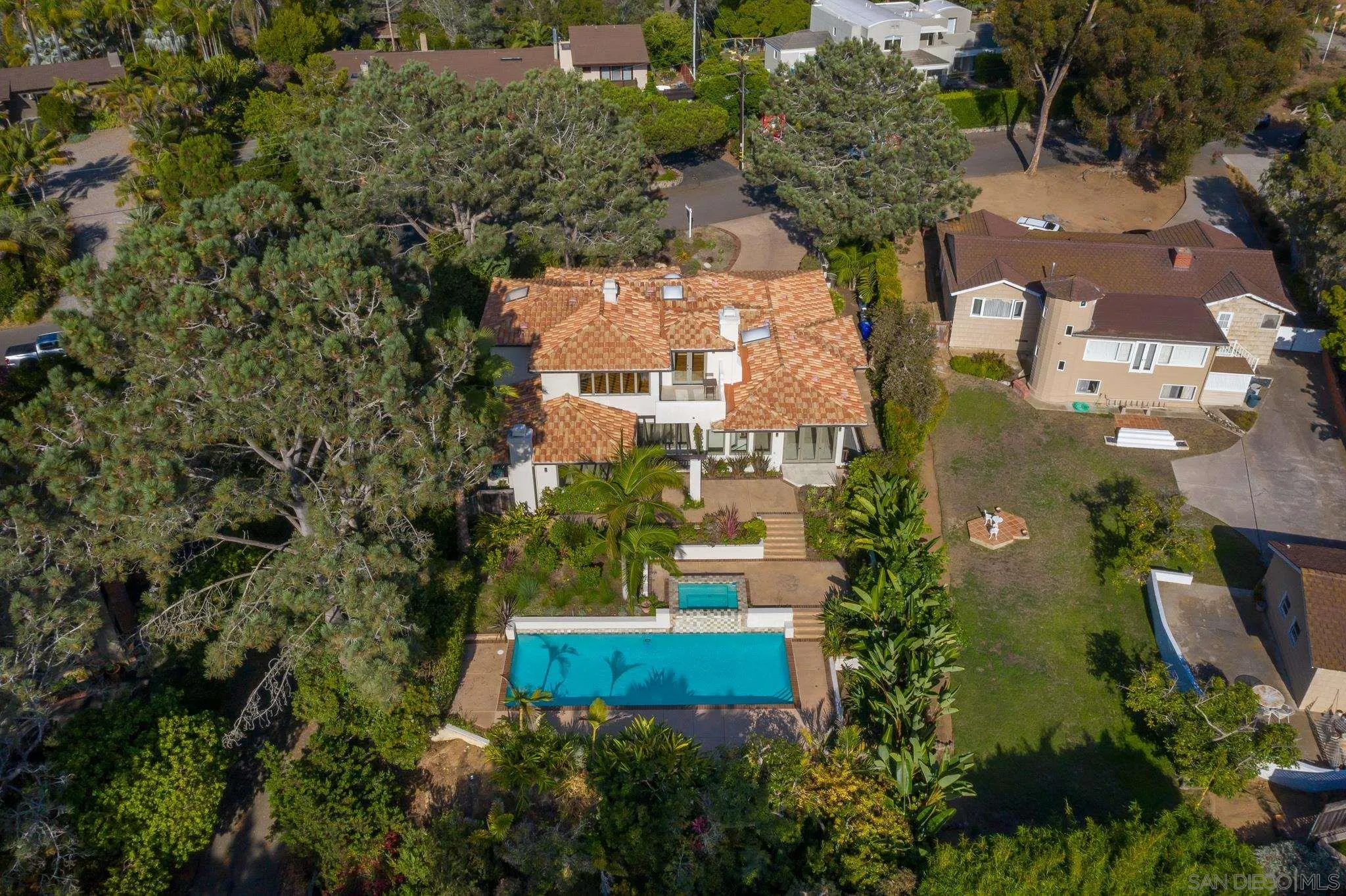 1346 Crest Road Del Mar, CA 92014 - Photo 61 of 64 an aerial view of a house with a yard and trees