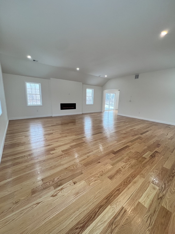 252 East County Road Rutland, MA 01543 - Photo 22 of 42 an empty room with wooden floor and windows
