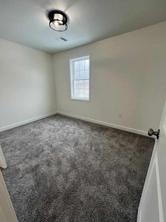 252 East County Road Rutland, MA 01543 - Photo 34 of 42 an empty room with a empty space and windows
