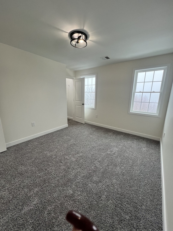 252 East County Road Rutland, MA 01543 - Photo 39 of 42 an empty room with a empty space and windows