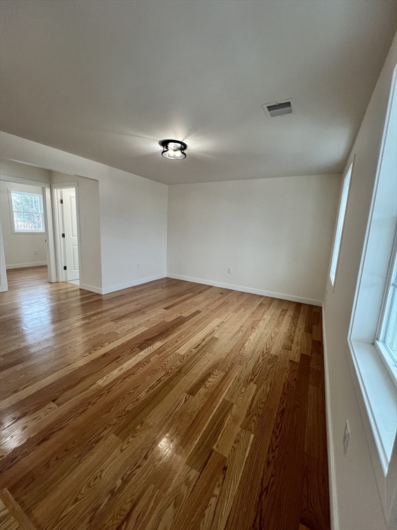 252 East County Road Rutland, MA 01543 - Photo 5 of 42 wooden floor in an empty room with a window