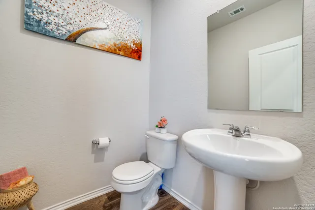a bathroom with a sink and a toilet