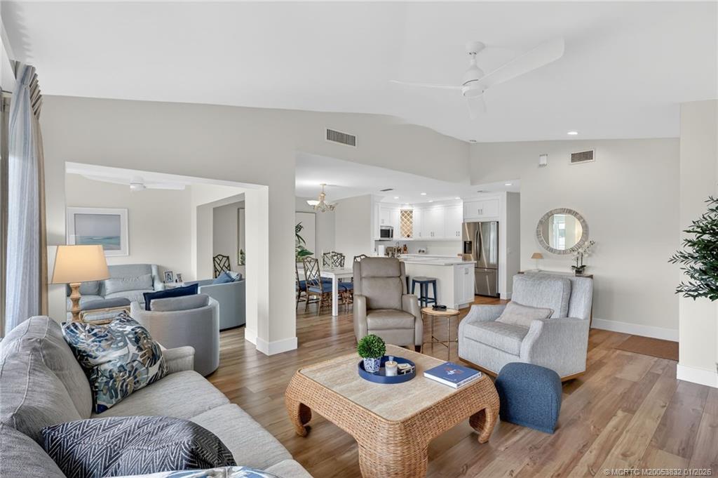 5627 Southeast Foxcross Place Stuart, FL 34997 - Photo 12 of 72 a living room with furniture and wooden floor