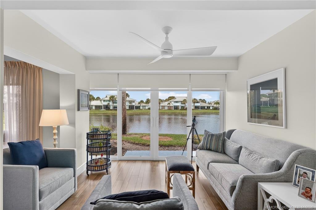 5627 Southeast Foxcross Place Stuart, FL 34997 - Photo 15 of 72 a living room with furniture and a large window