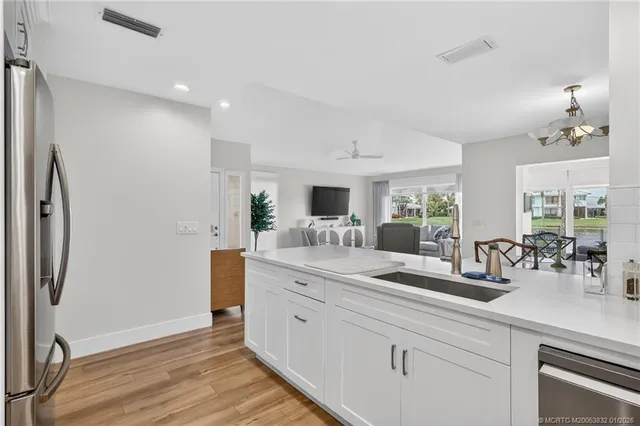 a bedroom with a bed and a refrigerator