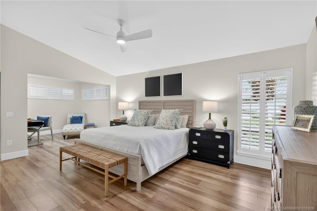 5627 Southeast Foxcross Place Stuart, FL 34997 - Photo 22 of 72 a bedroom with a bed and window