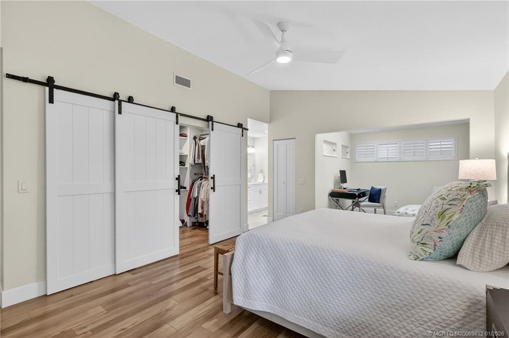 5627 Southeast Foxcross Place Stuart, FL 34997 - Photo 23 of 72 a bedroom with a bed and a closet