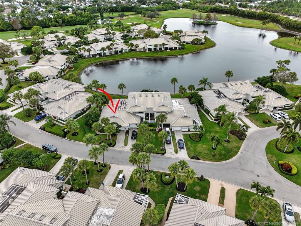5627 Southeast Foxcross Place Stuart, FL 34997 - Photo 52 of 72 an aerial view of a house with a lake view