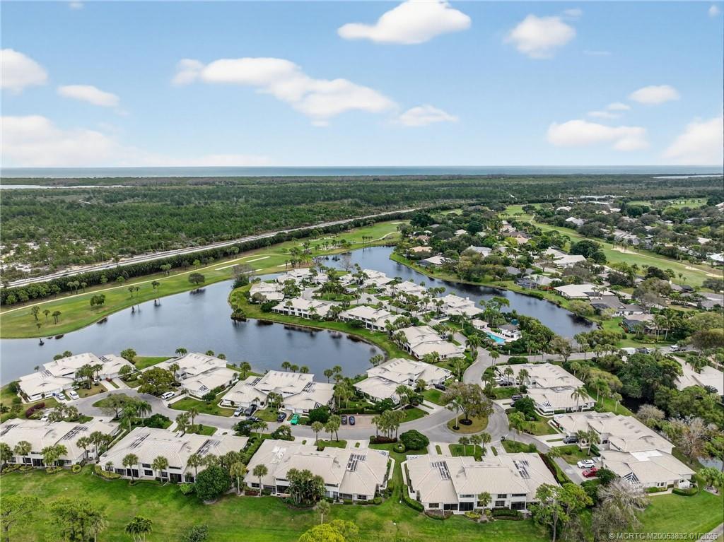 5627 Southeast Foxcross Place Stuart, FL 34997 - Photo 60 of 72 an aerial view of a house with a lake view