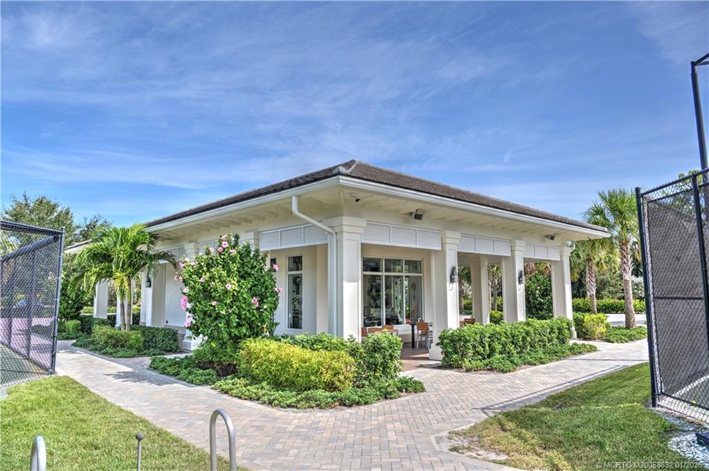 5627 Southeast Foxcross Place Stuart, FL 34997 - Photo 66 of 72 front view of a house with a yard