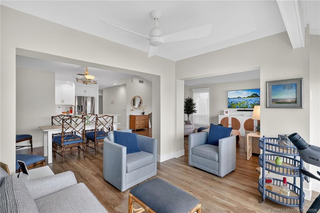 5627 Southeast Foxcross Place Stuart, FL 34997 - Photo 10 of 72 a living room with furniture and a wooden floor