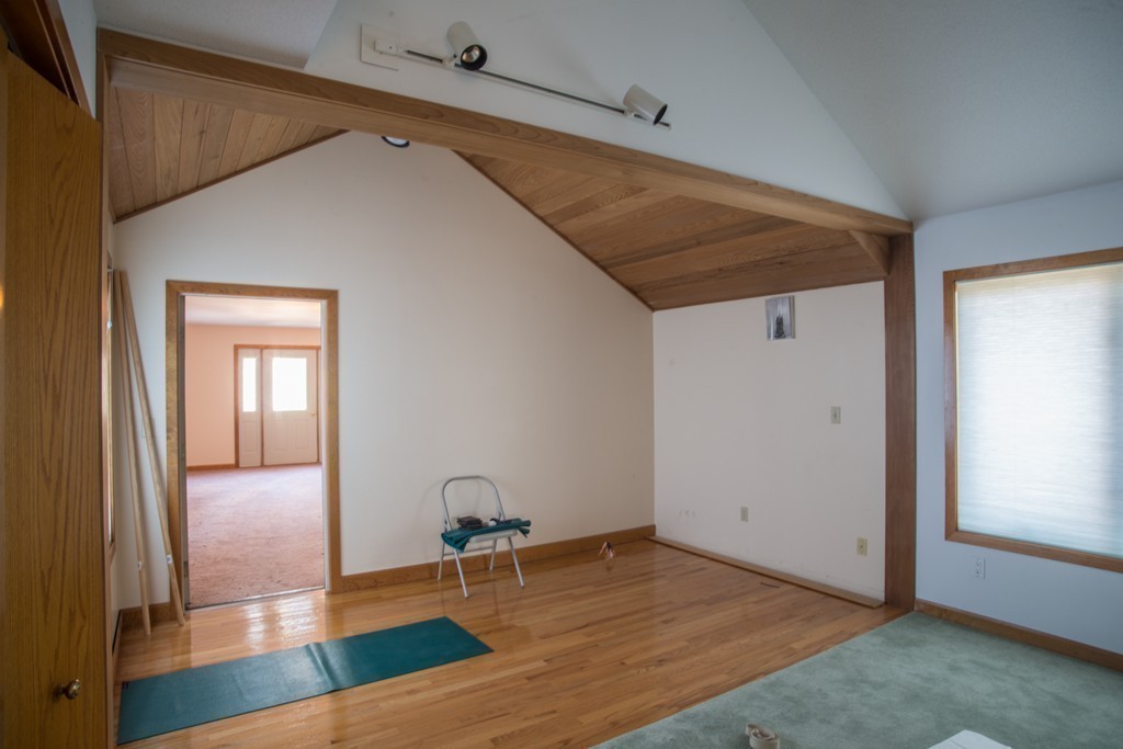61 South Valley Road Amherst, MA 01002 - Photo 26 of 38 a view of a livingroom with wooden floor and a hallway