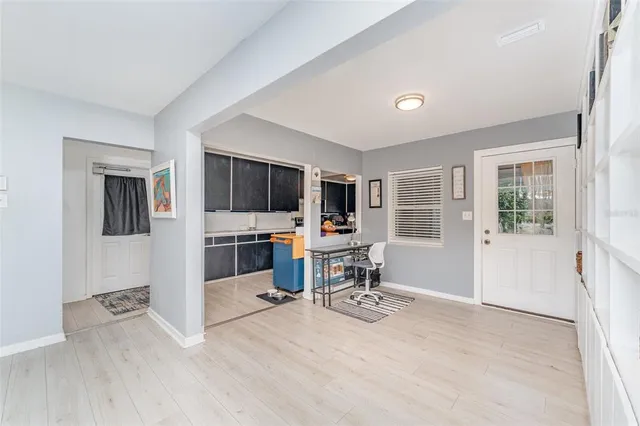 a view of a livingroom with furniture and a flat screen tv