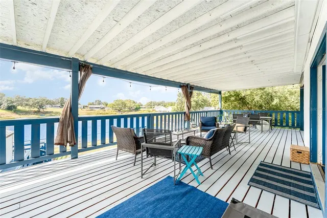 a view of a patio with wooden floor