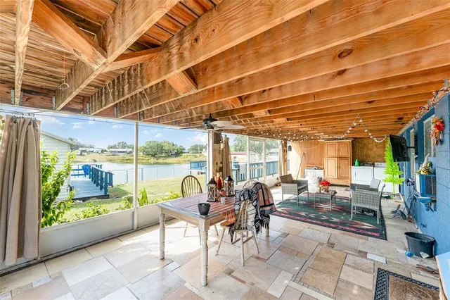 a view of a patio with a dining table and chairs
