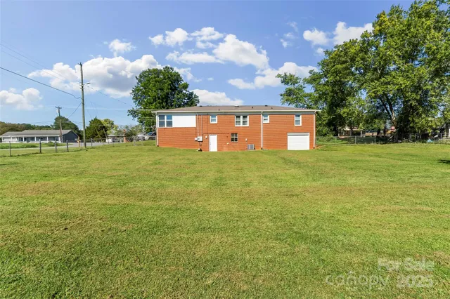 a view of a house with a big yard