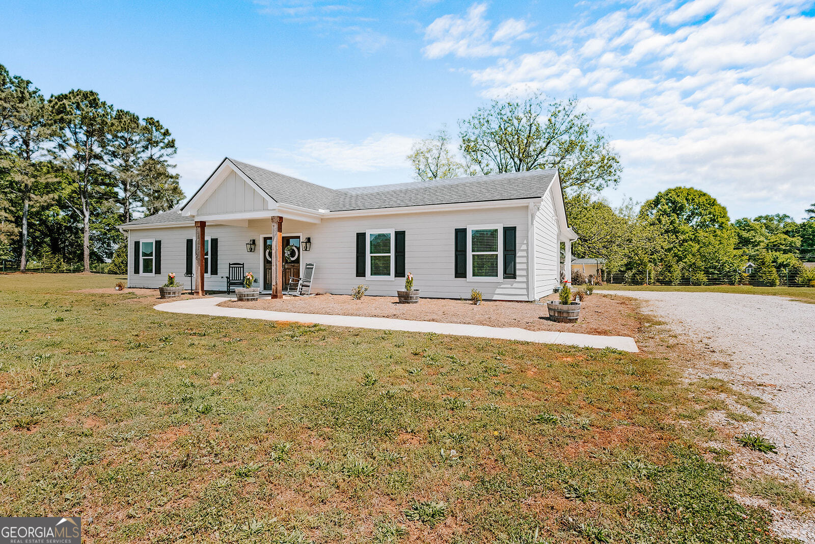 1150 Chivers Road Buckhead, GA 30625 - Photo 2 of 29 a swimming pool view with a seating space and a garden view