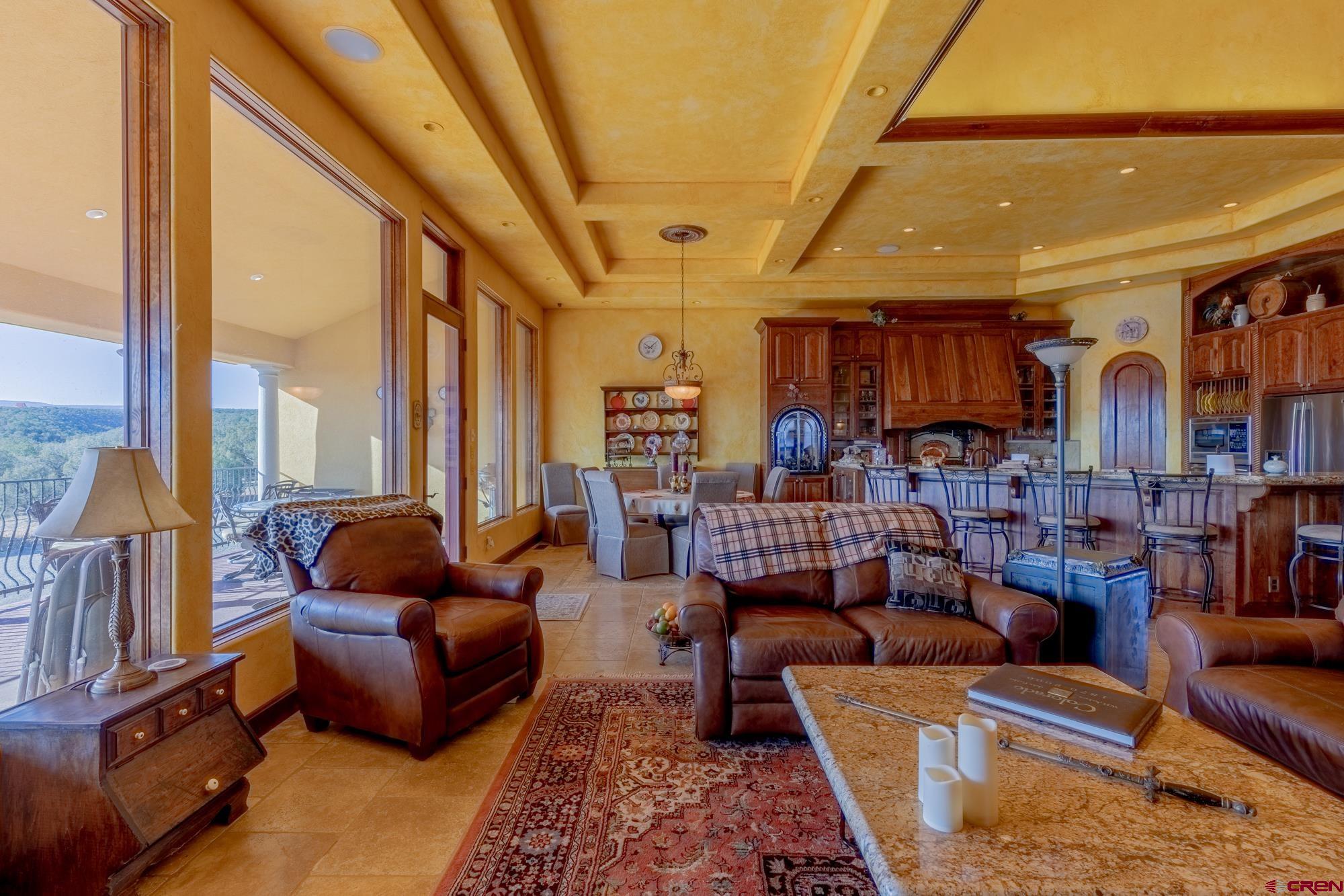 19754 Dave Wood Road Montrose, CO 81403 - Photo 13 of 35 a living room with furniture and a large window