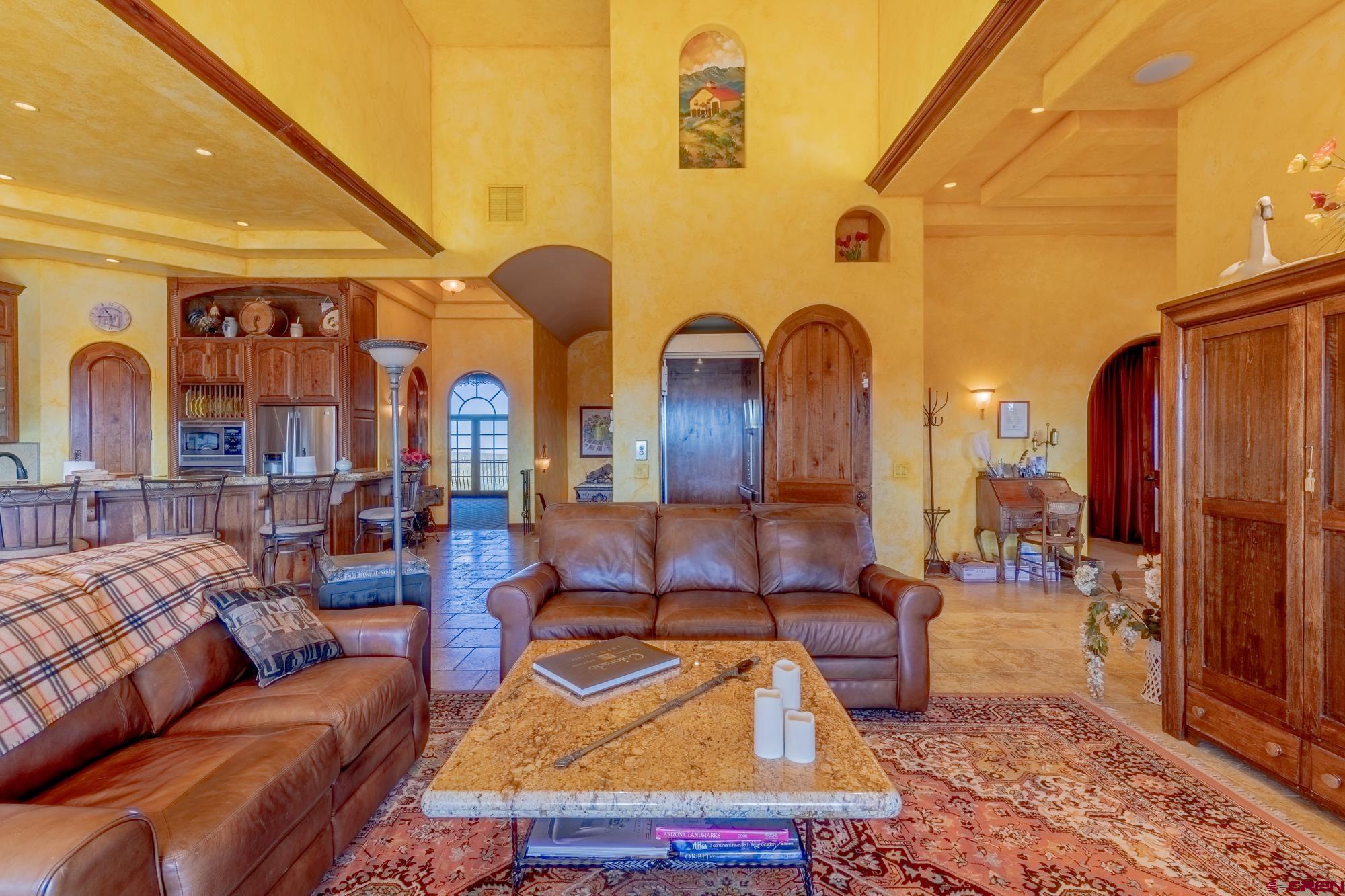 19754 Dave Wood Road Montrose, CO 81403 - Photo 16 of 35 a living room with patio furniture and wooden floor