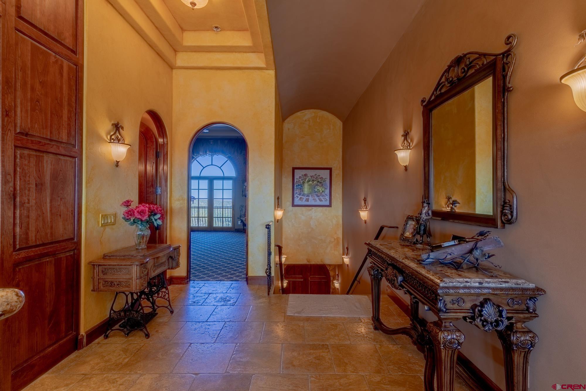19754 Dave Wood Road Montrose, CO 81403 - Photo 19 of 35 a living room with furniture and a dresser with wooden floor