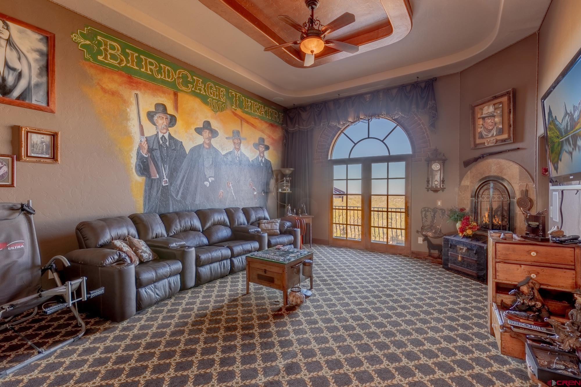 19754 Dave Wood Road Montrose, CO 81403 - Photo 21 of 35 a living room with furniture a window and a flat screen tv