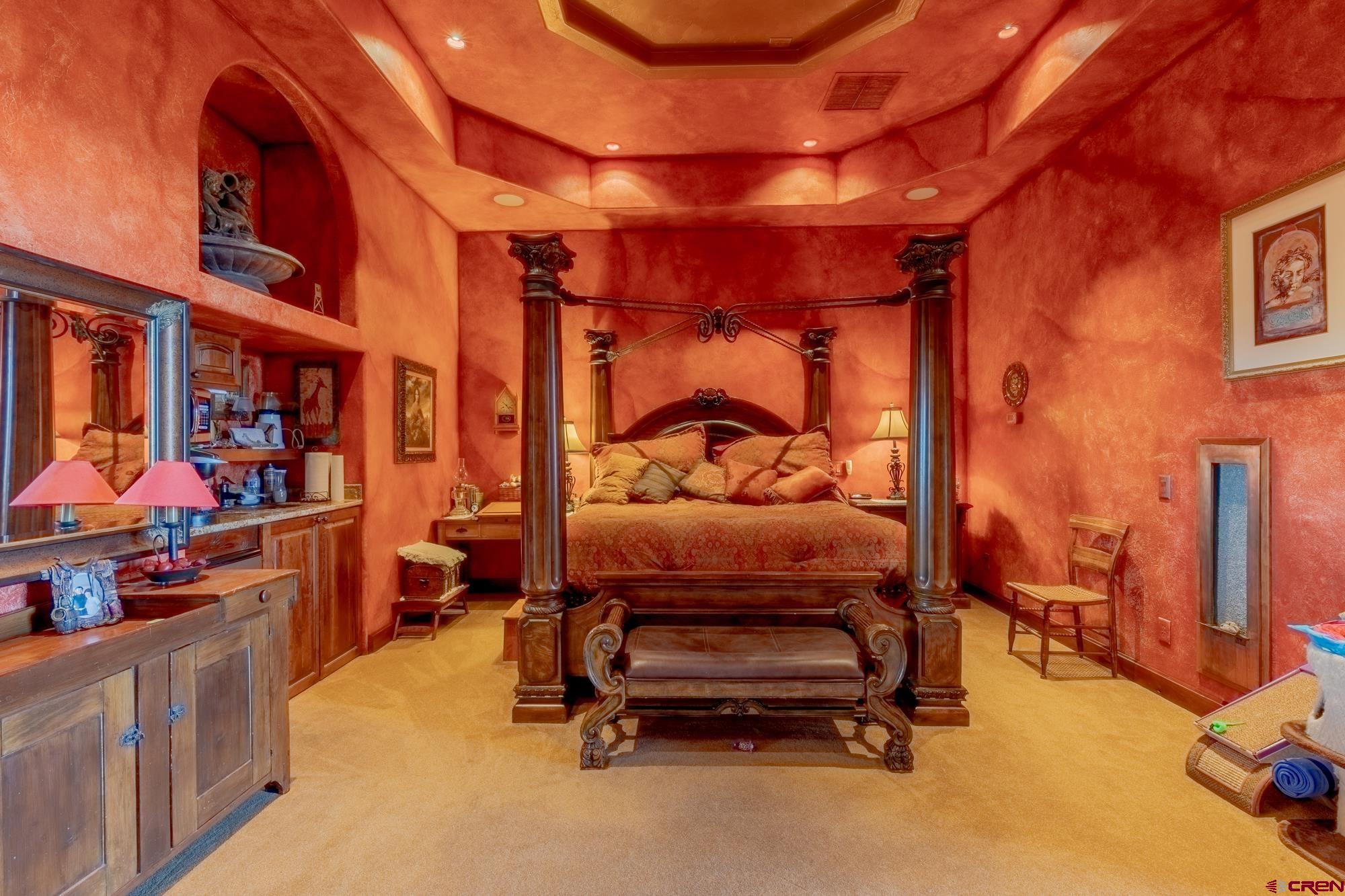 19754 Dave Wood Road Montrose, CO 81403 - Photo 26 of 35 a bedroom with furniture and a bed