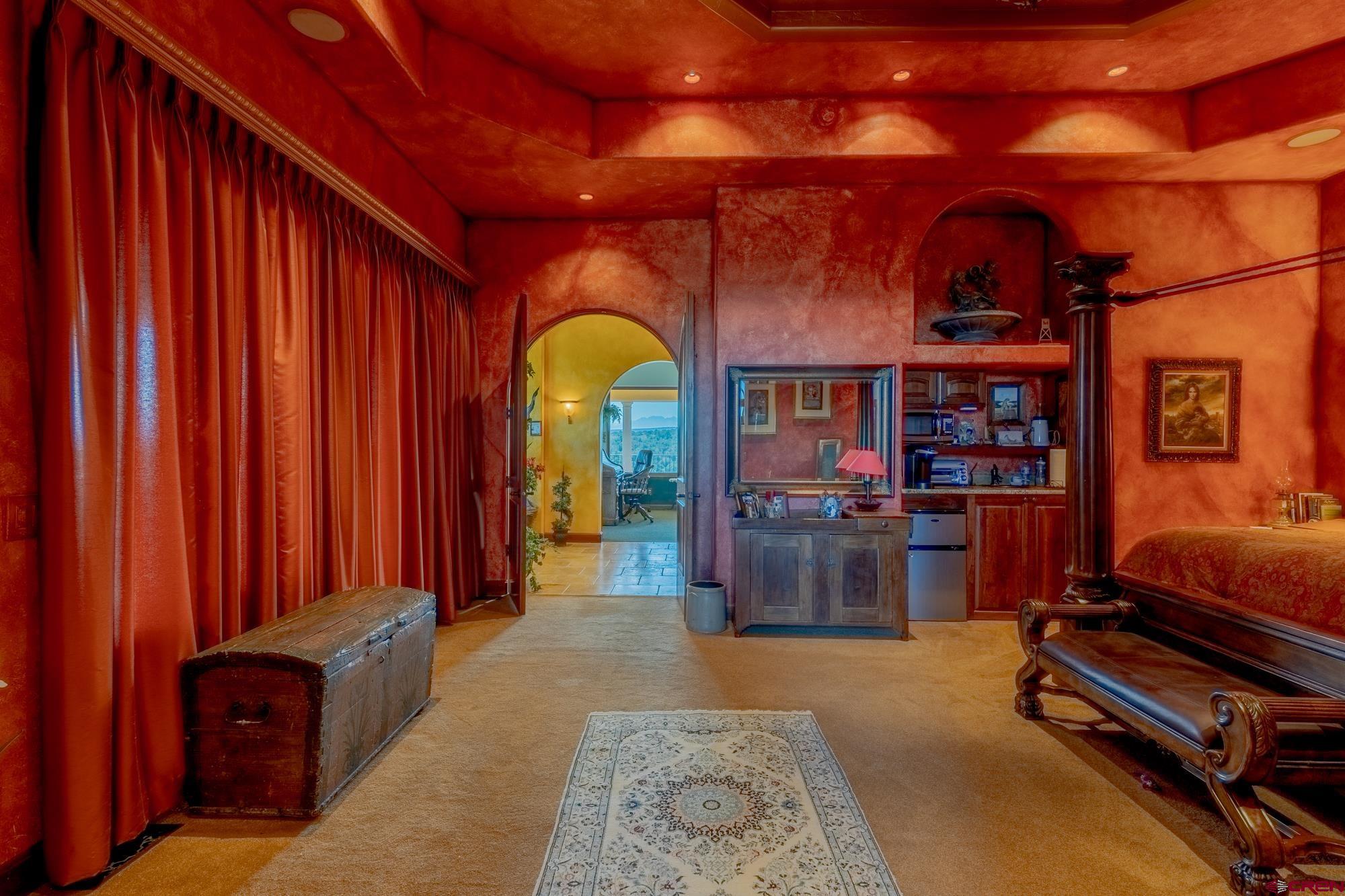 19754 Dave Wood Road Montrose, CO 81403 - Photo 27 of 35 a living room with furniture and wooden walls
