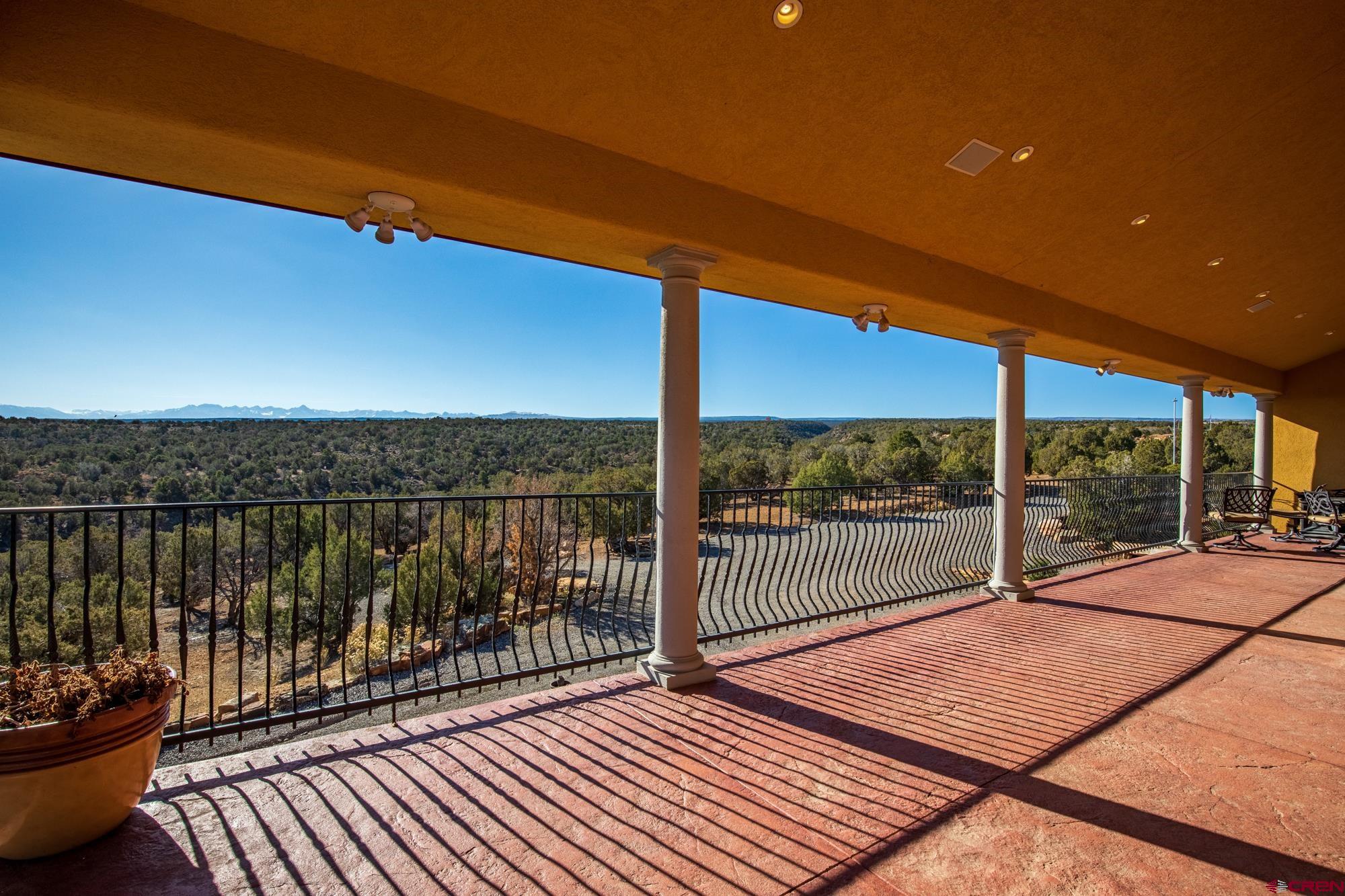 19754 Dave Wood Road Montrose, CO 81403 - Photo 32 of 35 a balcony with chairs