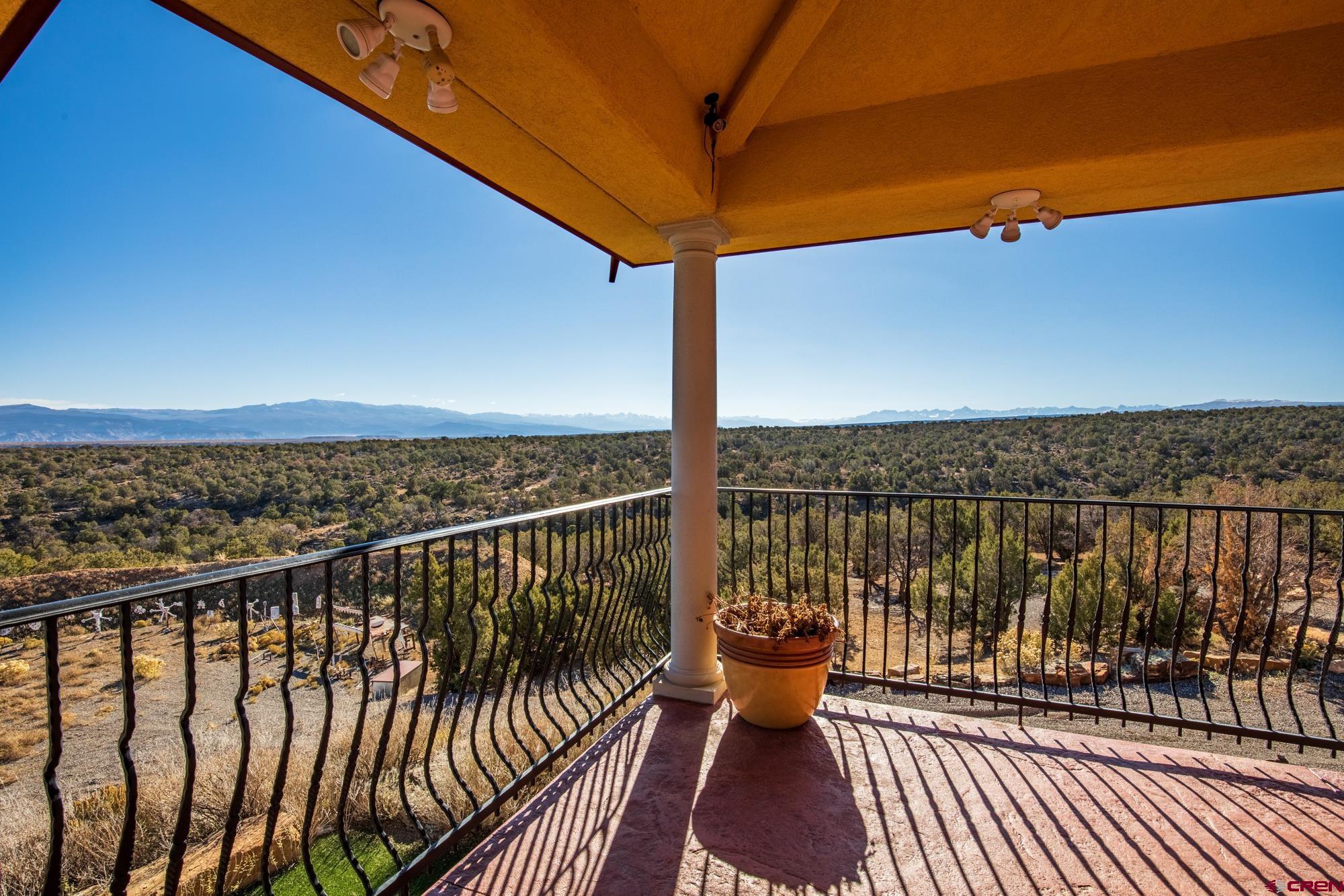 19754 Dave Wood Road Montrose, CO 81403 - Photo 33 of 35 a balcony with wooden floor