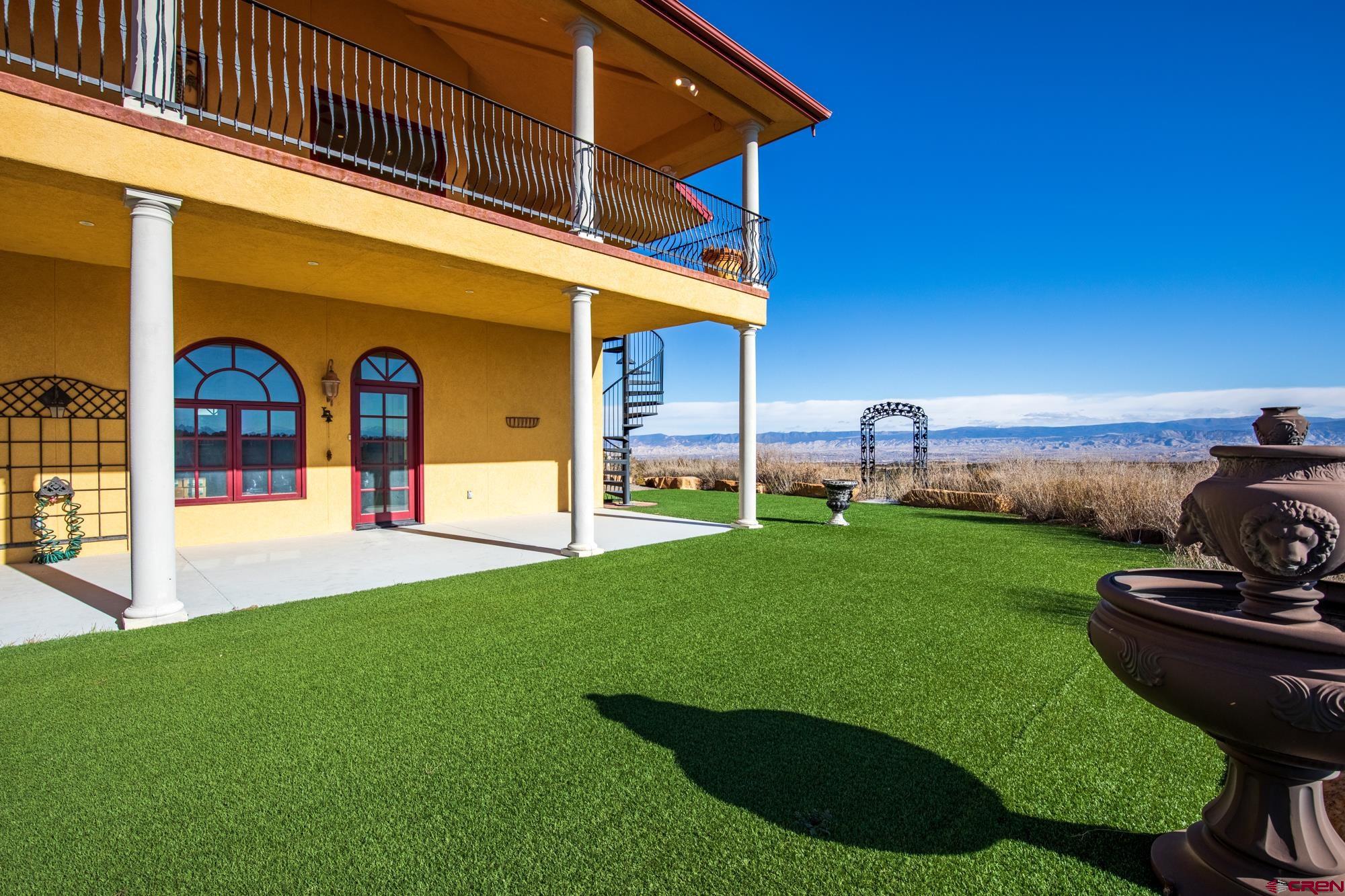 19754 Dave Wood Road Montrose, CO 81403 - Photo 35 of 35 a view of a house with backyard and porch