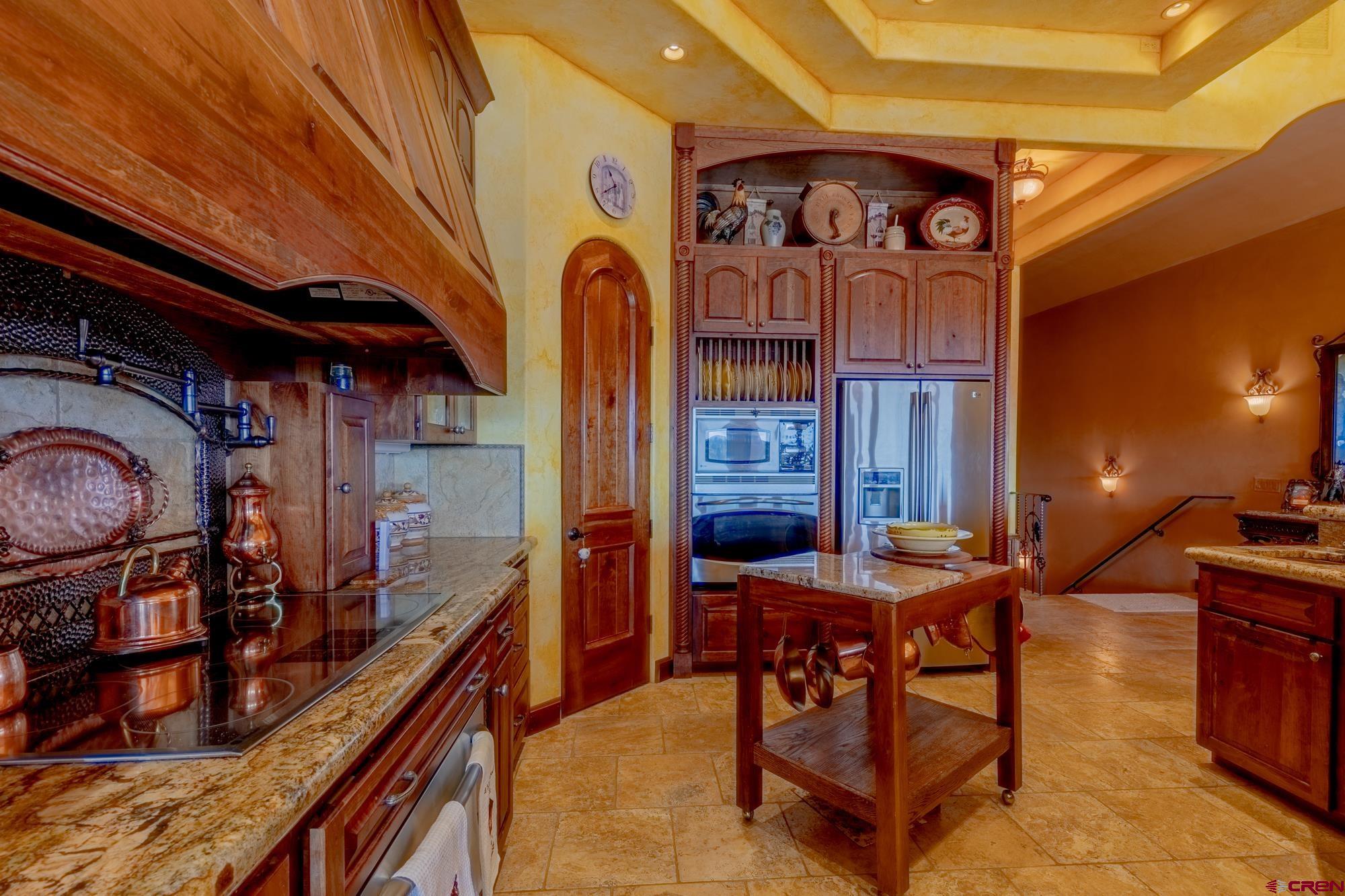 19754 Dave Wood Road Montrose, CO 81403 - Photo 5 of 35 a view of a chairs and tables in patio