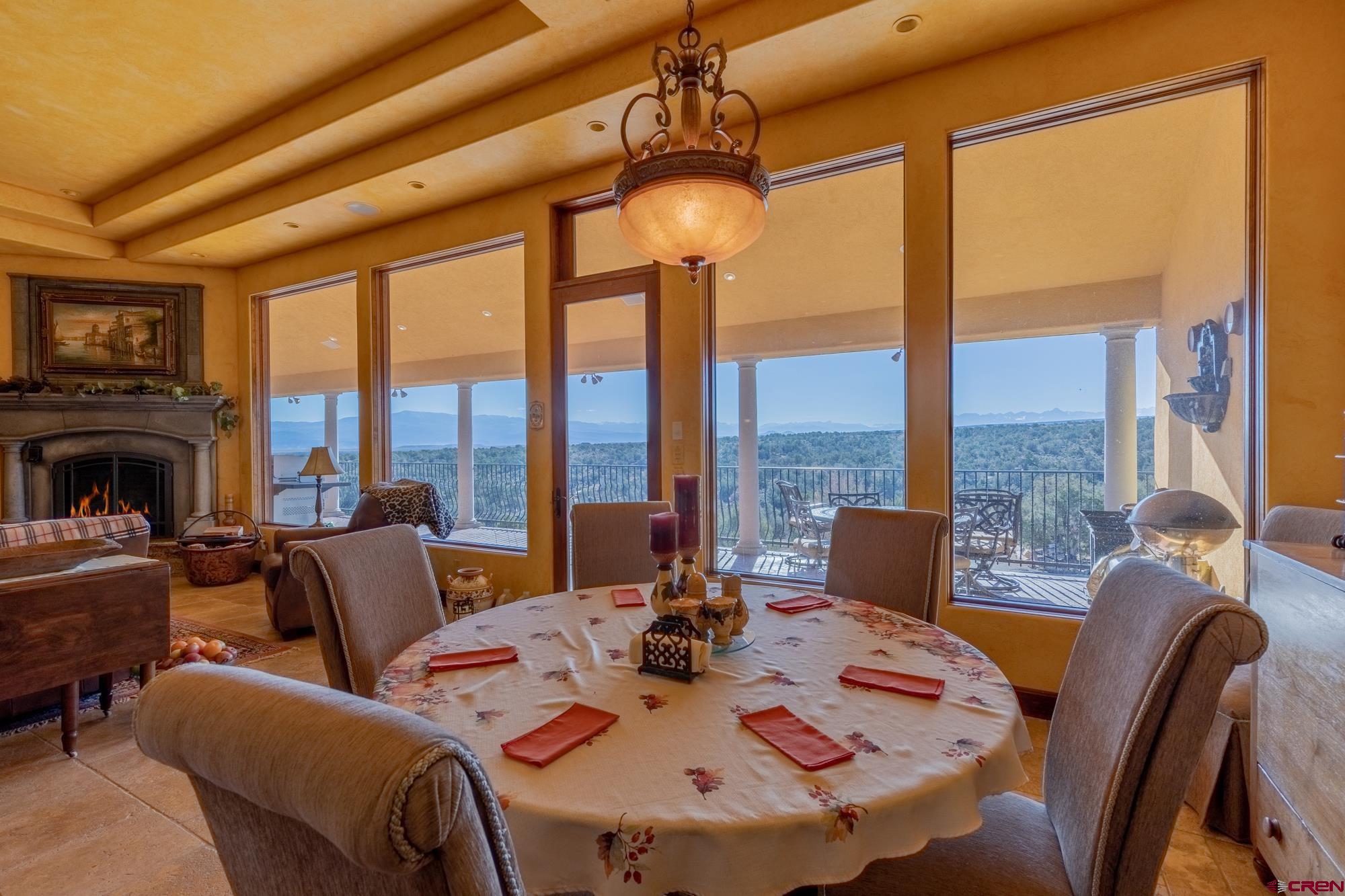 19754 Dave Wood Road Montrose, CO 81403 - Photo 8 of 35 a view of a dining room with furniture window and outside view