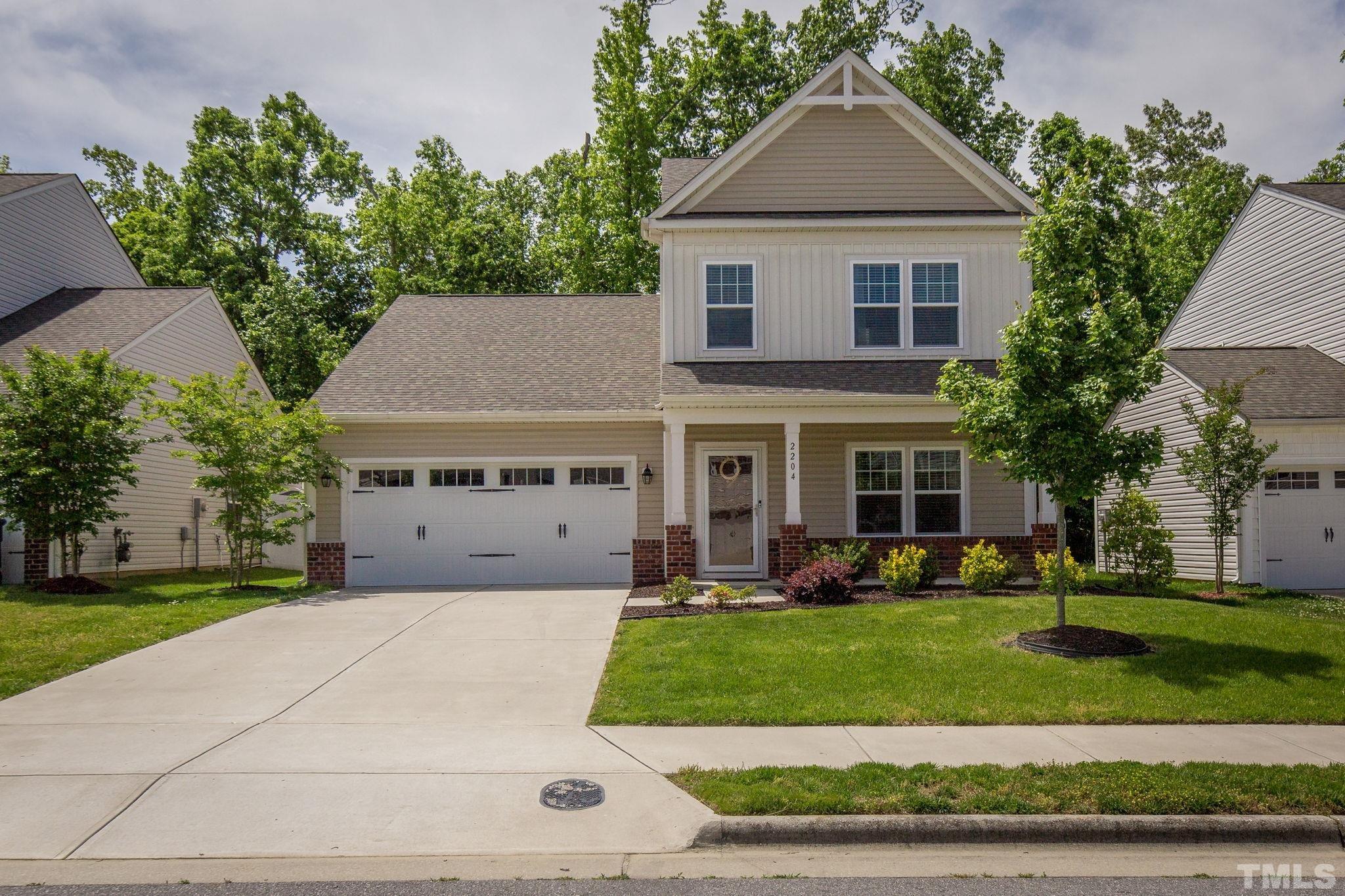 2204 Owls Nest Trail McLeansville, NC 27301 - Photo 1 of 35 front view of a house with a yard