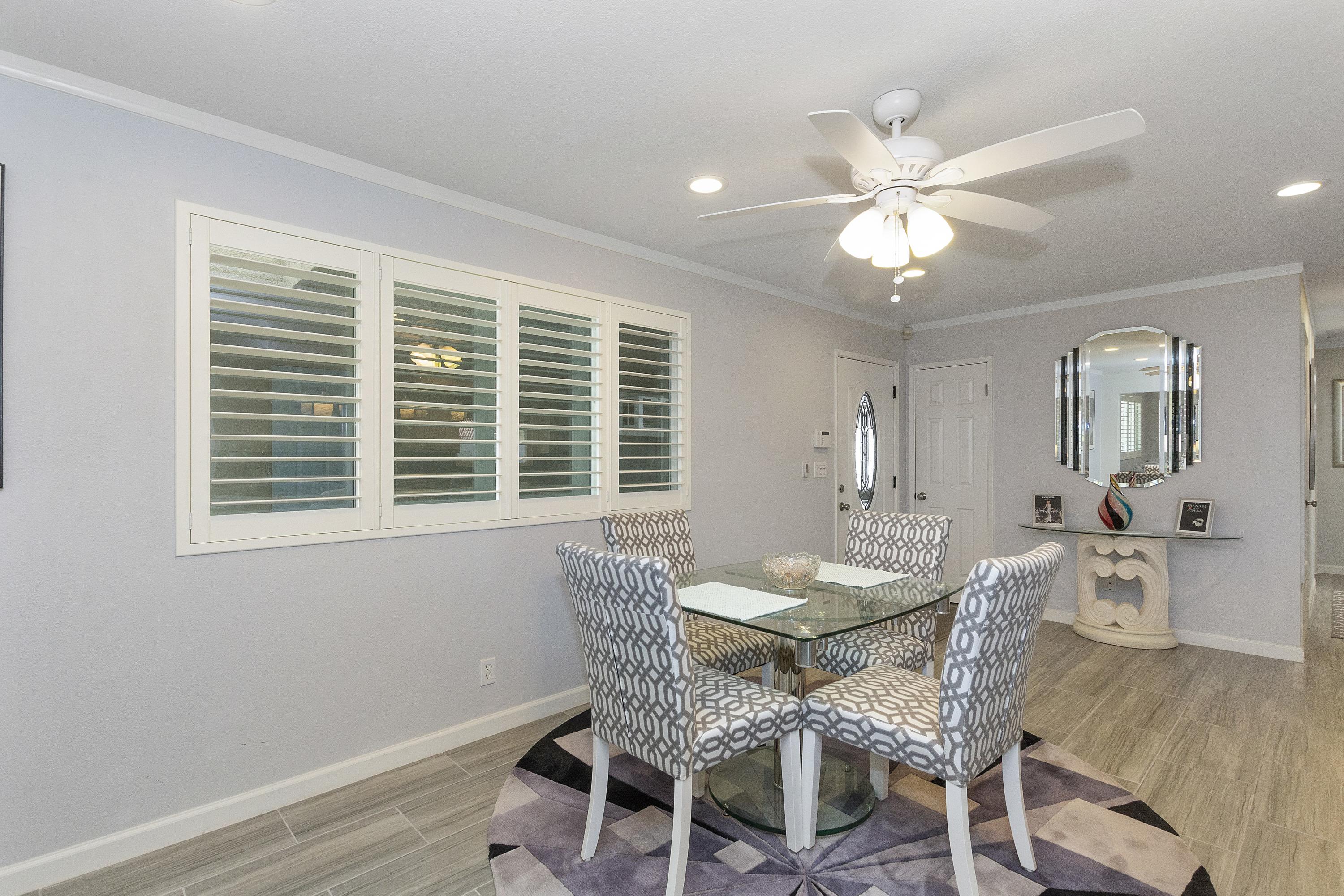 70061 Cobb Road Rancho Mirage, CA 92270 - Photo 14 of 33 a view of a dining room with furniture and wooden floor