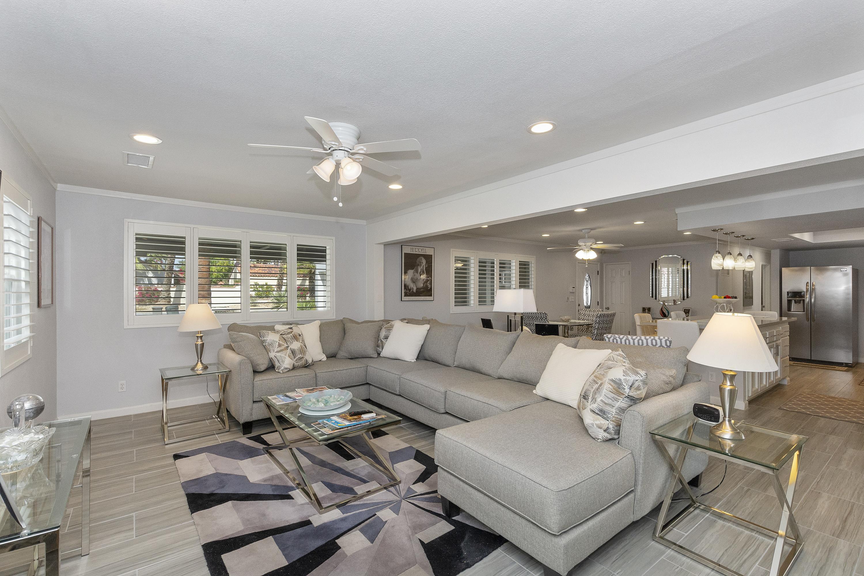 70061 Cobb Road Rancho Mirage, CA 92270 - Photo 16 of 33 a living room with furniture and a large window