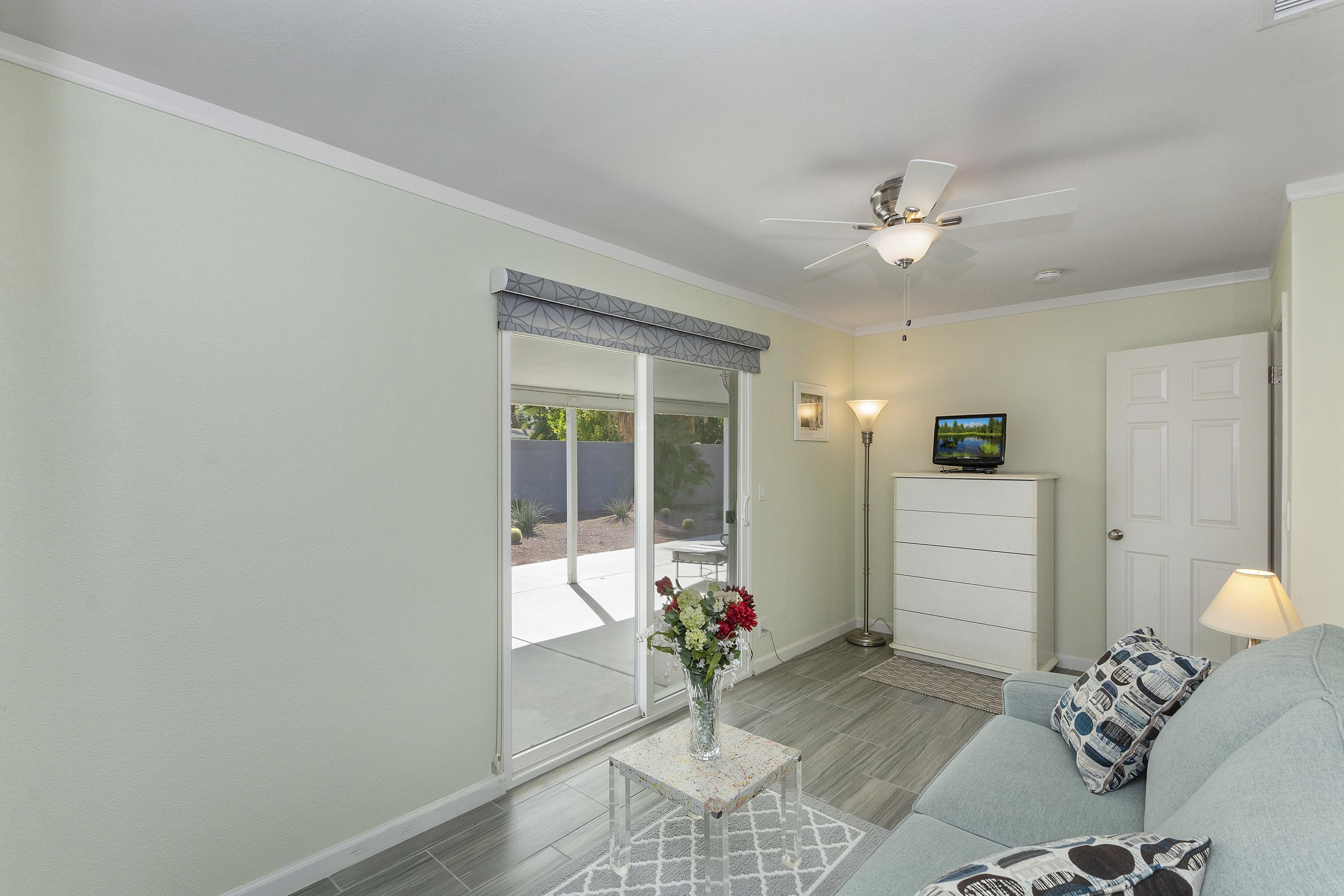 70061 Cobb Road Rancho Mirage, CA 92270 - Photo 24 of 33 a living room with furniture and flowers