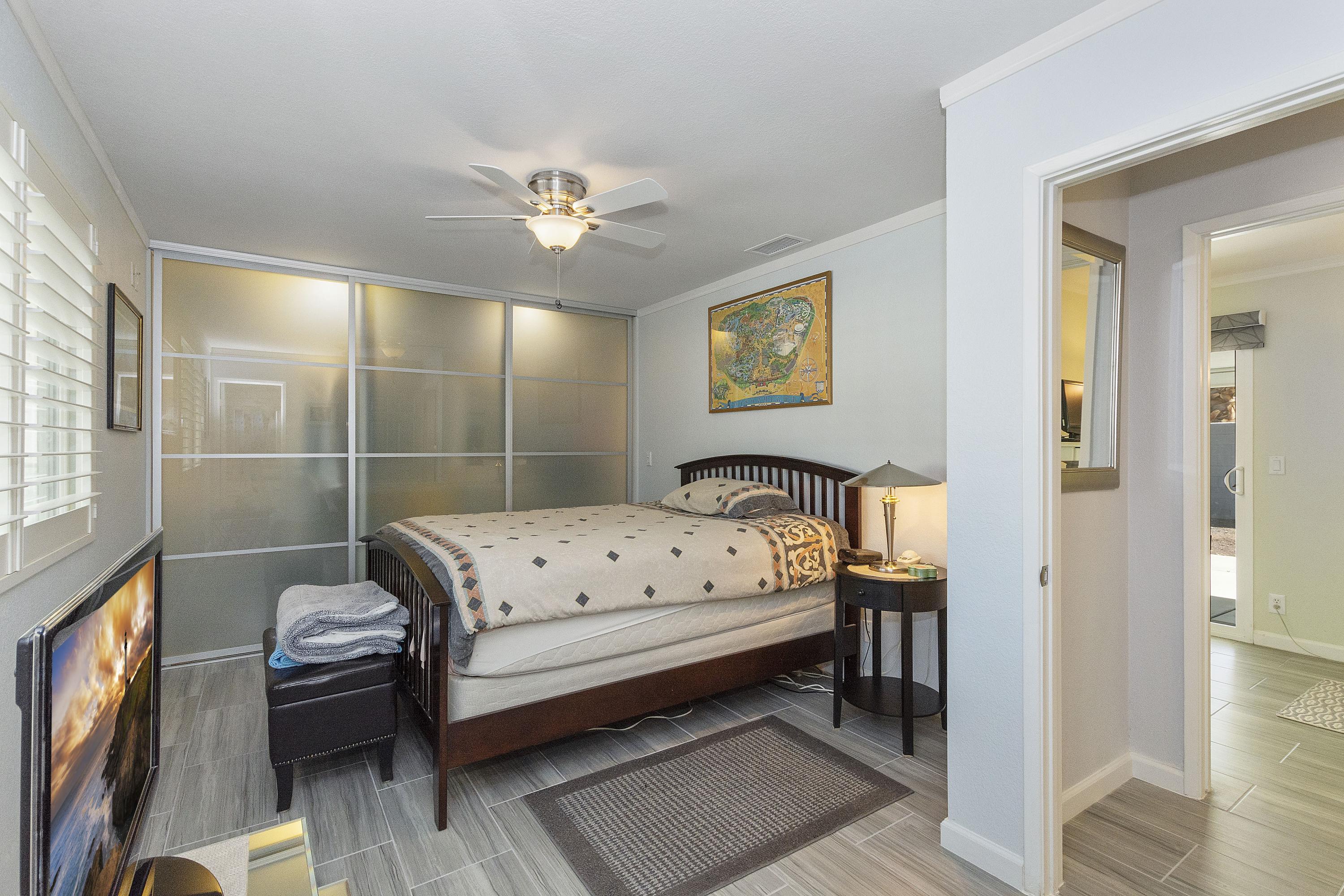 70061 Cobb Road Rancho Mirage, CA 92270 - Photo 25 of 33 a bedroom with a bed and a chandelier