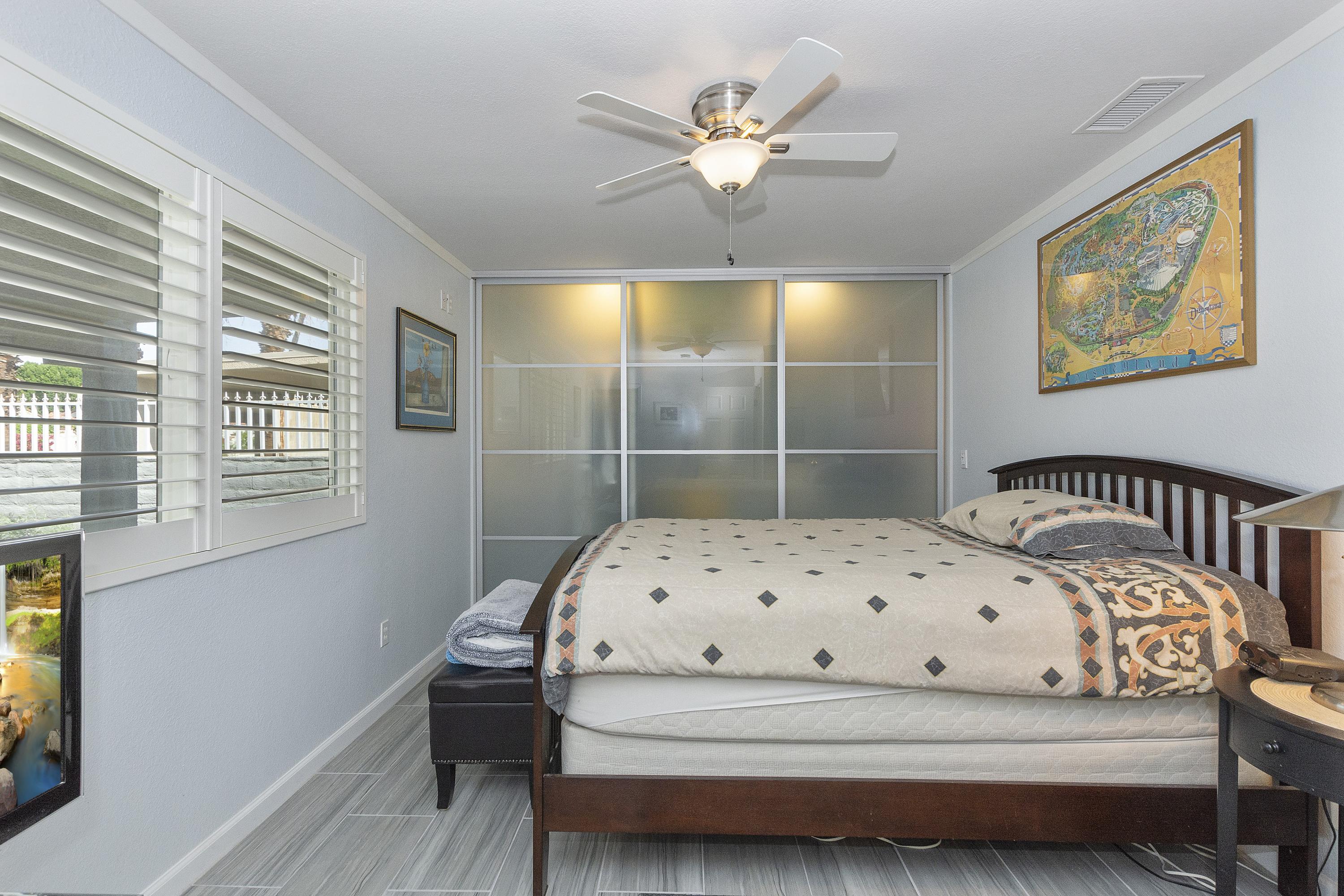 70061 Cobb Road Rancho Mirage, CA 92270 - Photo 26 of 33 a bedroom with a bed and a window