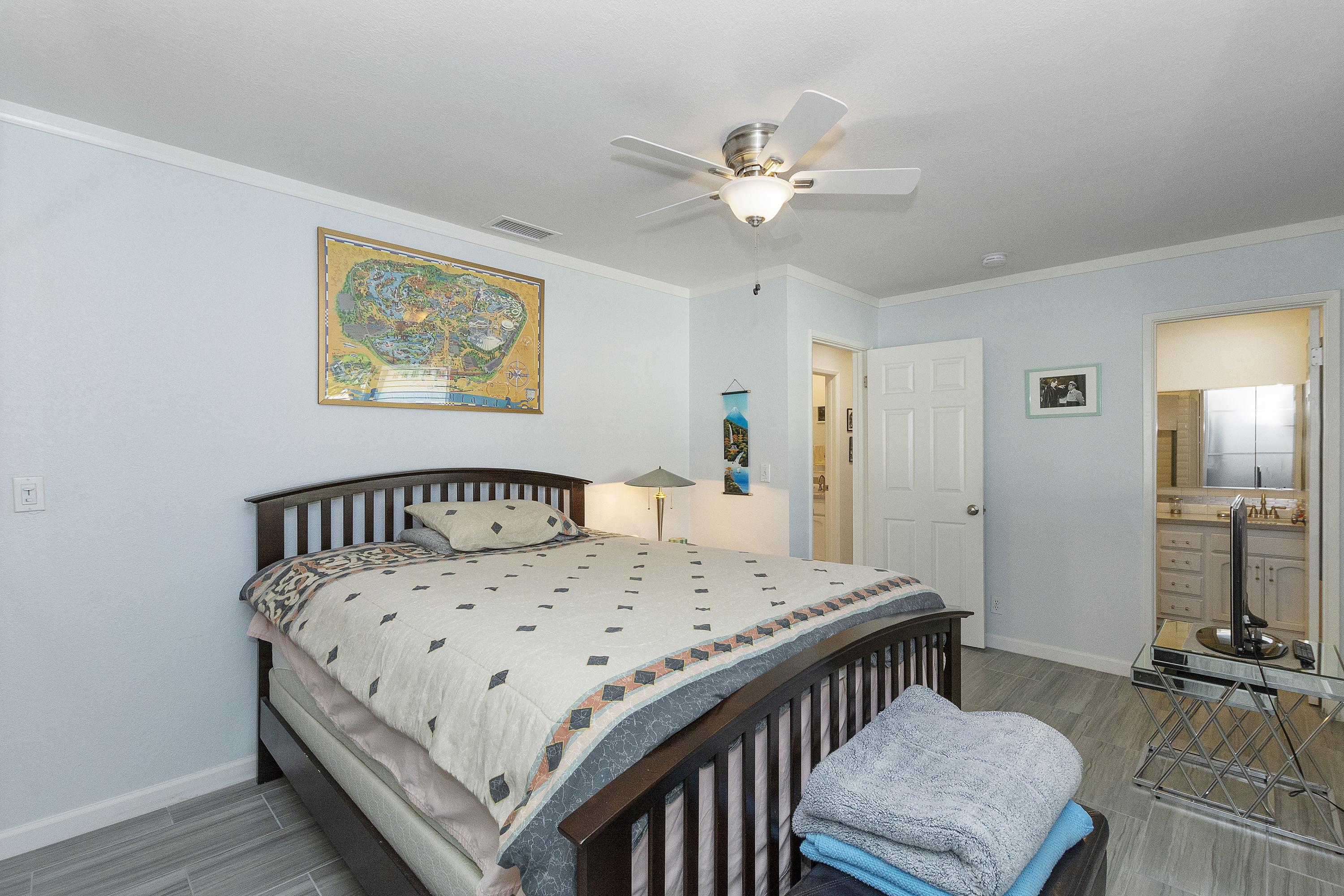 70061 Cobb Road Rancho Mirage, CA 92270 - Photo 27 of 33 a bedroom with a bed and a table in it