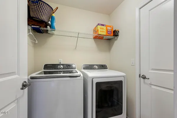 a utility room with dryer and washer
