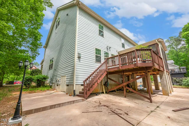 a view of a house with wooden fence