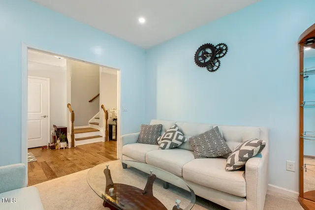 a living room with furniture and a table