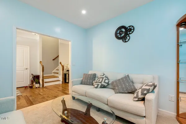 a living room with furniture and a table