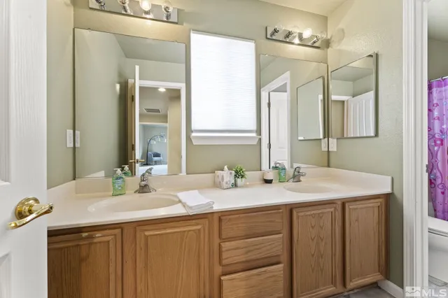 a bedroom with double bed and a window