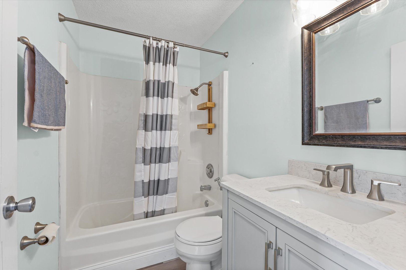 702 Devonshire Drive Champaign, IL 61820 - Photo 14 of 37 a bathroom with a sink toilet and shower